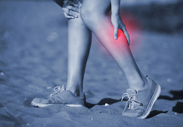 Person hold calf muscle red with pain after military workout