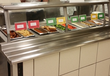 Cafeteria meals with displayed food cards help service members make healthy choices for optimal performance.