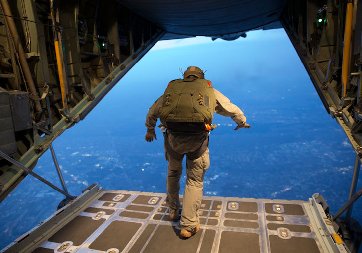 U S  Marine conducts high altitude     low opening jump from the back of an Air Force C-130H Hercules aircraft  U S  Air Forc