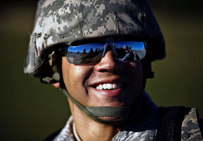 Airman laughs after a long day of training showing resilience and total force fitness gained from HPRC resources   U S  Air F