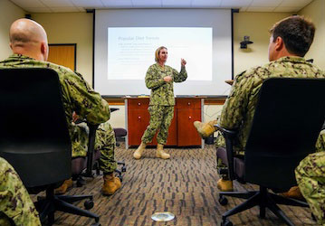 A military dietician presents a class on performance nutrition to other Service Members. U.S. Navy photo by Mass Communication Specialist 2nd Class Kelsey J. Hockenberger