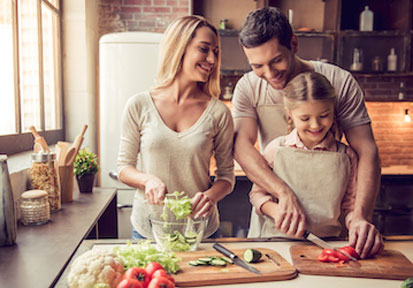 Family cooking together to optimize family relationships and performance nutrition 
