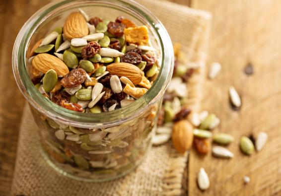 Jar filled with nuts  seeds  and dried fruit from HPRC recommended mix-and-match snack recipe ideas for optimal performance  