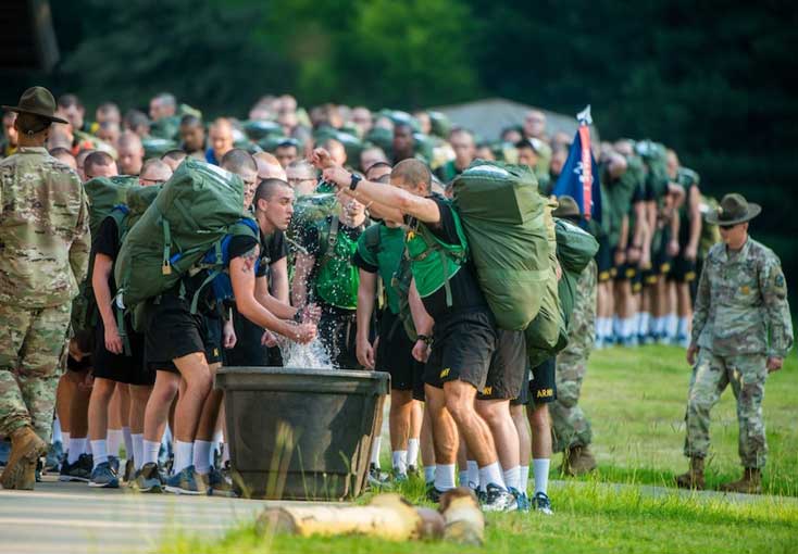 Infantrymen use troughs of ice and water during military training  to prevent injuries and holistically improve military fitn