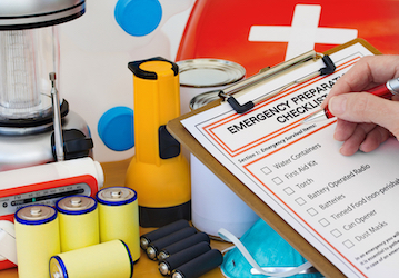 Person completing Emergency Preparation Checklist achieves military readiness and boosts family resiliency with planning and 