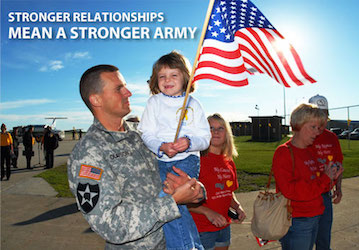 Soldier and child holding an American flag next to other family members build military family relationships with resilience a