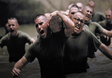 Marine recruits performing a log carry to improve physical fitness for optimal military performance    Photo by US Marine Cor