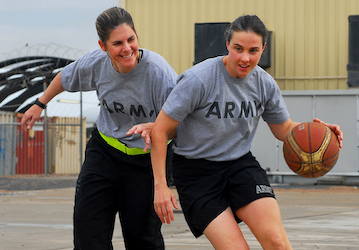 Women soldiers do a military workout and play basketball to train and practice teamwork  U S  Army photo by Spc  Samuel Soza 