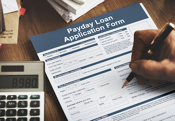 Person completes payday loan application and needs information on military financial wellness 