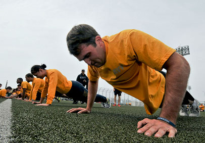 Sailors in PT uniform doing push-ups build total body strength for optimal military performance   U S  Navy photo by Mass Com