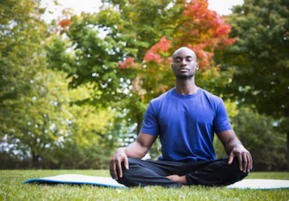 Man practicing outdoor meditation to build holistic wellness and bolster total force fitness  