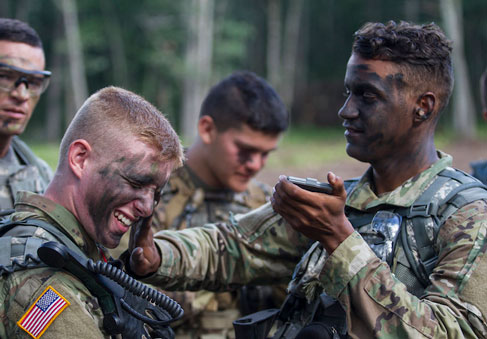 Soldiers and cadets using teamwork to prepare for a live fire exercise  U S  Army photo by Sgt  Seth LaCount