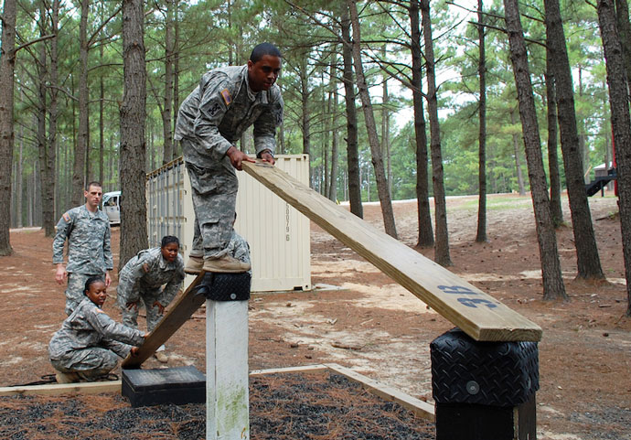 Soldiers compete in an obstacle challenge   U S  Army photo by Sgt  1st Class Gary A  Witte  642nd Regional Support Group 