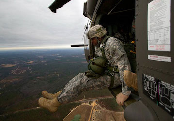 Service Member jumps from a UH-60M Black Hawk as part of military training (U.S. Army Photo by Sgt. Michael J. MacLeod)