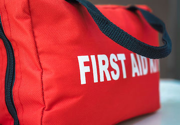 First aid kit highlighting the importance of proper care of mental and physical injuries in total force fitness 