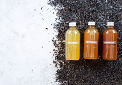Bottles of kombucha  which has benefits and risks to fueling military performance nutrition