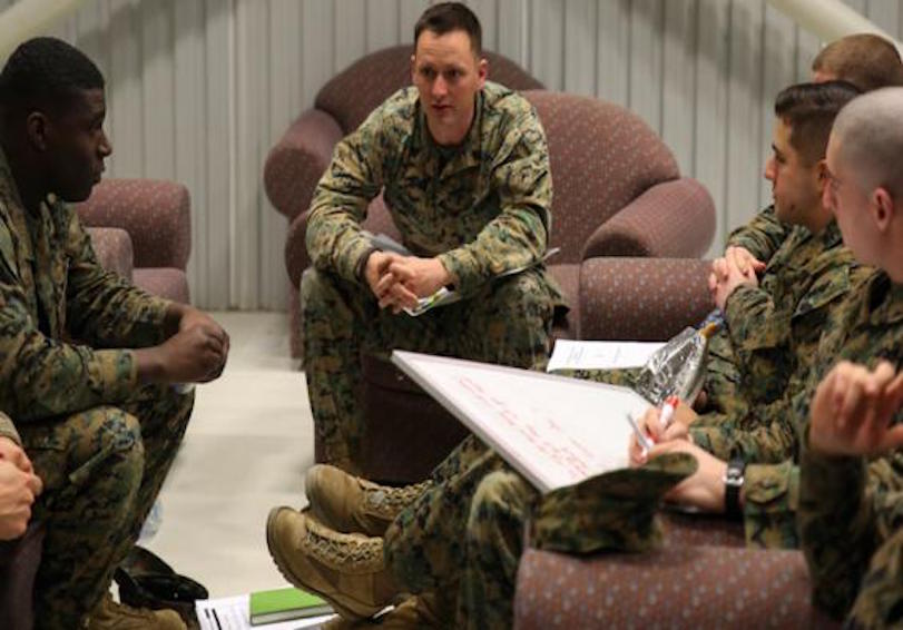 Group of Marines communicating and using teamwork to avoid substance use issues 