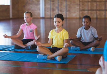 Children boosting mental health and resilience by practicing mindful meditation  