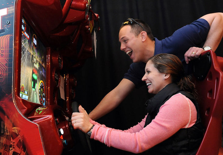 Couple playing arcade game together. (Official Army Photo/ Dustin Senger)