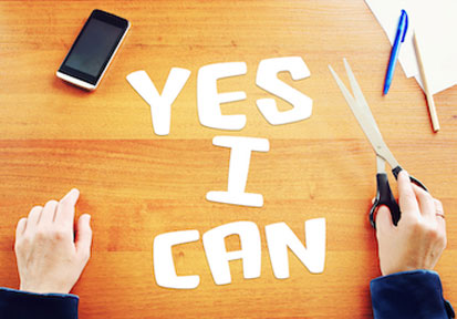 Person spelling  Yes I can  with cut out letters highlighting resilience  mental health  and performance optimization  