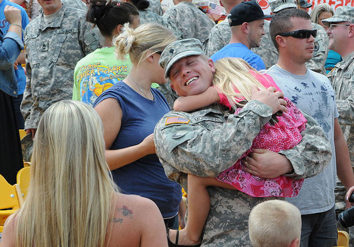 Spc. Daniel Morrison of the 1204th Aviation Support Battalion greets his family during the unit's welcome home ceremony at the Florence Freedom Baseball staudium in Florence, Ky., Aug. 18, 2012. The 1204th deployed last August to the Persian Gulf region in support of Operation New Dawn. Kentucky National Guard photo by Sgt. Scott Raymond