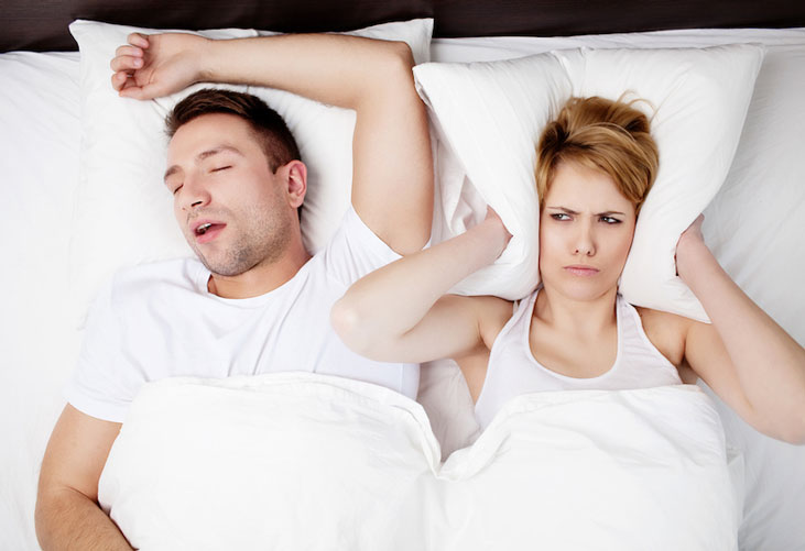 Man snoring while partner can t sleep