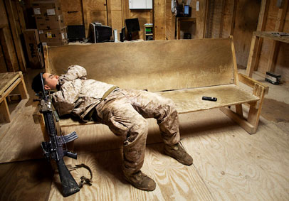 Marine takes a nap on a wooden bench to manage stress after military optimization exercises   U S  Marine Corps photo by Cpl 