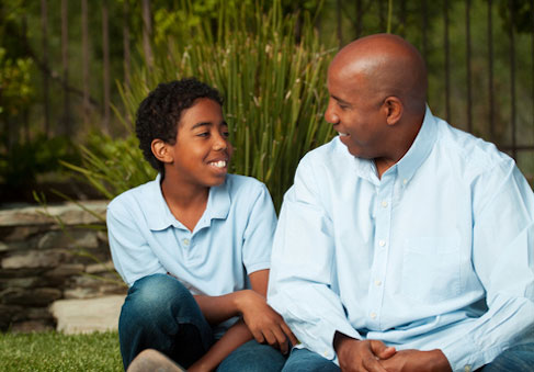 Father and son talking and using HPRC tips for healthy communication and family optimization 