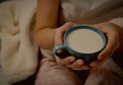 Woman drinking warm milk before bed could use HPRC resources on sleep  performance optimization  and performance nutrition 