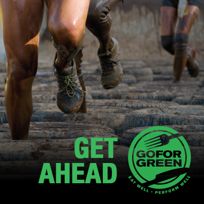 Get Ahead. Service members compete in obstacle course with tires.  Go for Green logo.
