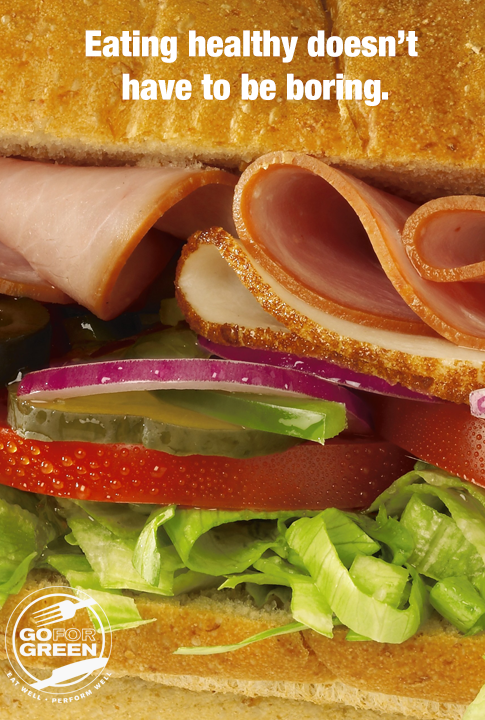 Eating Healthy Doesn’t Have to be Boring. Sandwich with turkey and fresh vegetables. Go for Green logo.