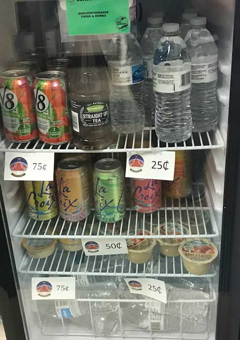 Mini-fridge filled with healthy drinks and snacks