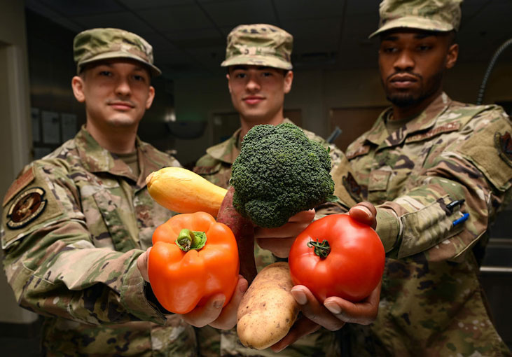U.S. Air Force Airmen from the 633rd Medical Group Nutritional Medicine Clinic pose for a photo at Joint Base Langley-Eustis, Virginia, June 14, 2021. Vegetables are full of vitamins, minerals, and fiber that help people regulate and stay healthy. (U.S. Air Force photo by Senior Airman Alexandra Singer)