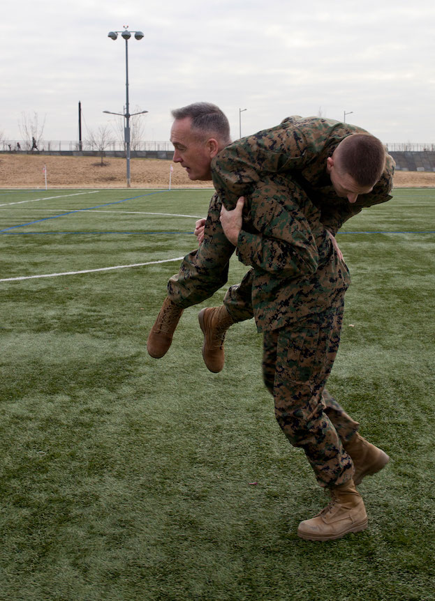 Commandant of the Marine Corps, Gen. Joseph F. Dunford, Jr., left, fireman carries Maj. Bradley W. Ward, the Marine aide-de-camp to the commandant, during a Combat Fitness Test (CFT). (U.S. Marine Corps photo by Sgt. Gabriela Garcia/Released)