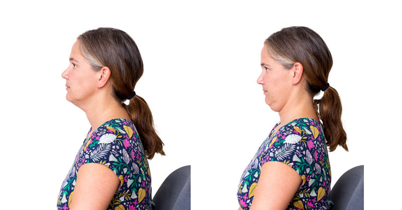 Person stretching their neck by pulling their chin back.