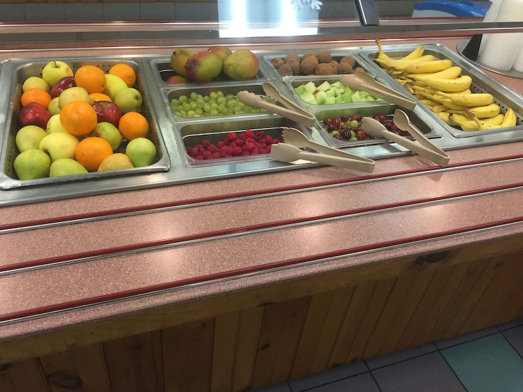 Salad bar offering healthy whole fruit options