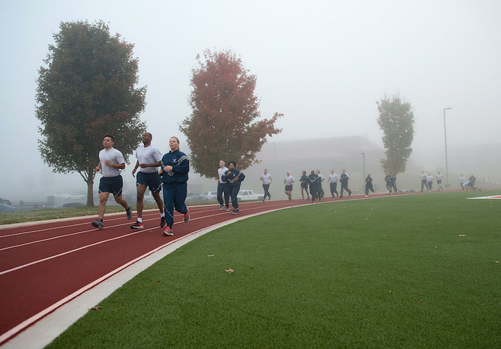 U S  Air Force Airmen exercise at the campus track on a foggy morning   U S  Air National Guard photo Master Sgt  Mike R  Smi