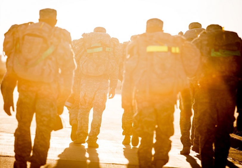 Service Members complete military workout ruck march in hot desert conditions and use holistic performance optimization strat
