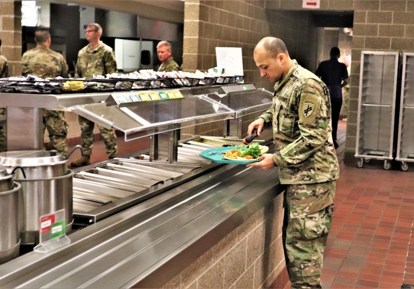 Soldier in cafeteria  Photo by Scott Sturkol