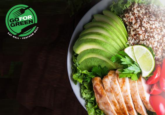 Go for green logo. Bowl of healthy food - avocado, baked chicken, tomatoes, quinoa.