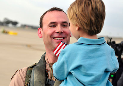 Pilot greets his son after deployment during which he used HPRC resources to maintain communication and relationships   U S  
