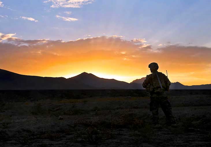 Soldier takes a sunrise break. U.S. Army photo by Spc. Chenee' Brooks.