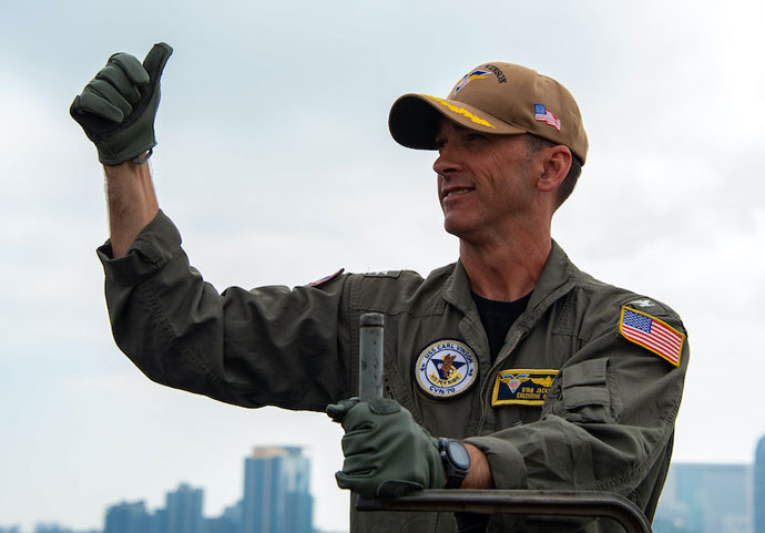Service Member signals  thumbs up   U S  Navy photo by Mass Communication Specialist Seaman Analice Baker