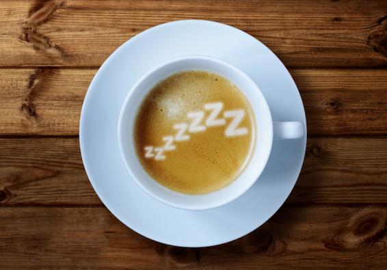 Cup of coffee with  ZZZZZZZ  written in the foam highlights HPRC strategies for optimizing sleep and military performance  